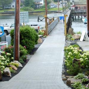 This new, inviting western entrance to the footbridge is the result of a joint community and municipal effort, spearheaded by the late Charlie Rowe’s daughters in his memory. SUE MELLO/Boothbay Register