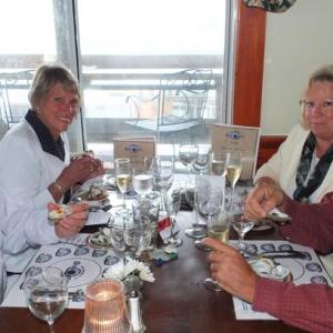 Ray and Carol Hulse, left, enjoy their first course of oysters with their good friends Jim and Janet Goff, right. RYAN LEIGHTON/ Boothbay Register