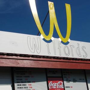 Wiscasset Speedway co-owner Richard Jordan unveiled this sign bearing the  concession stand's name July 27. SUSAN JOHNS/Wiscasset Newspaper