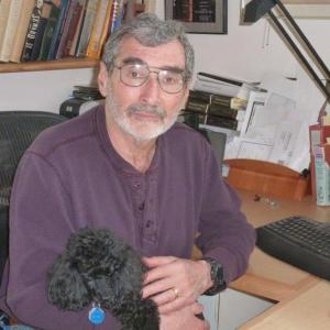 Biographer Fred Kaplan sits at his home office in Boothbay with his black toy poodle Kai as his constant companion. KATRINA CLARK/Boothbay Register Biographer Fred Kaplan sits at his home office in Boothbay with his black toy poodle Kai as his constant companion. KATRINA CLARK/Boothbay Register