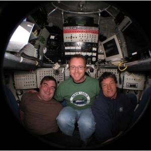 Dr. Pete Countway of Bigelow Laboratory, center, Dr. Shawn Polson of the University of Delaware, left, and submersible pilot Mark Spear of Woods Hole Oceanographic, right, aboard the Deep Submergence Vehicle Alvin during a dive to 2,000 meters at the Guaymas Basin hydrothermal vent field in the Gulf of California. Courtesy of Pete Countway.