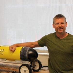 Bigelow Research Associate Dave Drapeau, right, with Henry, the remote control submarine. Courtesy of Bigelow Laboratory