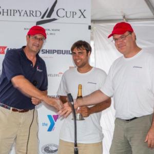 Hodgdon Yachts CEO Tim Hodgdon, left, congratulates representatives from the Scheherezade after the boat won the 2012 Shipyard Cup. Courtesy of Billy Black