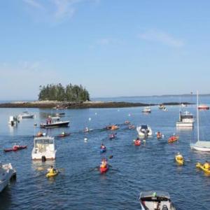 Under sunny skies, Southport Rowgatta paddlers depart from Newagen Harbor to round Southport Island and finish where they begain. SUE MELLO?Boothbay Register