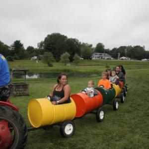 Taking a ride in barrels. KEVIN BURNHAM/Boothbay Register