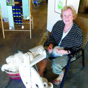 Weaver Ursula Smith of Boothbay was found spinning wool into yarn at Lincoln Art Festival's Arts & Yachts show held at the Boothbay Region Boatyard. GARY DOW/Boothbay Register