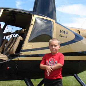 Alexander Colby, 6, of Wiscasset, grandson of Wiscasset Selectman Judy Colby, gets done with his helicopter ride. SUSAN JOHNS/Wiscasset Newspaper