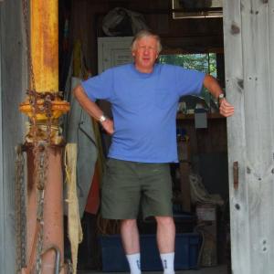 BILL ROYALL stands in the entrance of his studio in Southport. SUZI THAYER/Boothbay Register 