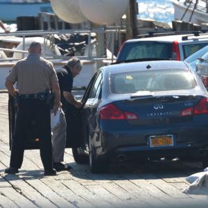 From right, Knox County Sheriff's Lt. Kirk Guerette, Sgt. John Palmer and car driver Cheryl Torgerson of New York City. (Photo by Ron Hawkes)