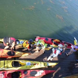 Brightly colored kayaks filled the Newagen town dock as paddlers prepare for the start of the 20th annual Rowgatta. SUE MELLO/Boothbay Register