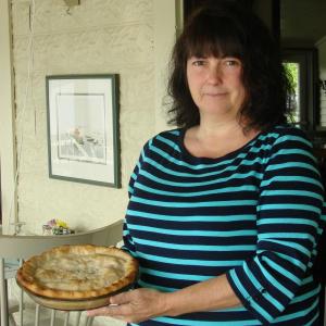 Daphne Cromwell of D-zerts by Daphne holds a pie she made for the Wiscasset restaurant Le Garage. SUSAN JOHNS/Wiscasset Newspaper Daphne Cromwell of D-zerts by Daphne holds a pie she made for the Wiscasset restaurant Le Garage. SUSAN JOHNS/Wiscasset Newspaper