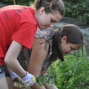 Morganne Elkins and Mackenzie Colby working on the church gardens. Courtesy of Deanne Tibbetts