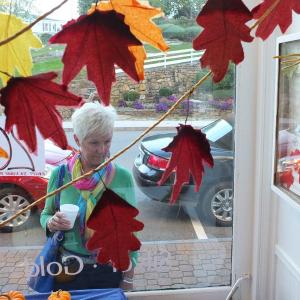 Pam O’Connor checks out the decorated store fronts at the Harbor Crawl in Boothbay Harbor. RYAN LEIGHTON/Boothbay Register 