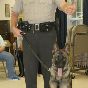 Patrol deputy Kevin Dennison explains the training that Duke, one of the Lincoln County Sheriff’s Office’s dogs, has to complete before becoming certified. Dennison and Duke were special guests at the Hometown Heroes event. KEVIN BURNHAM/Boothbay Register 