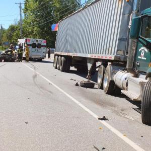 The front right wheel from the Mercury rests alongside of the Boothbay Region Refuse Disposal District truck. GARY DOW/Boothbay Register