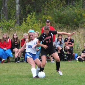 Sinead Miller grapples with a Lisbon defender. RYAN LEIGHTON/Boothbay Register