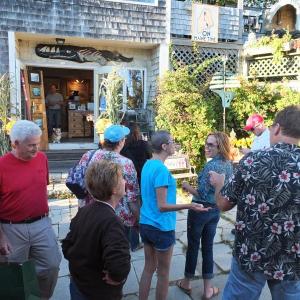 Wine and “pigs in a blanket” greeted the crawlers at  Coco Vivo Fine Art in Boothbay Harbor. RYAN LEIGHTON/Boothbay Register
