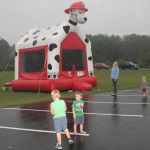 Despite the light rain, kids still enjoyed the bouncy house outside of the Legion Hall. KEVIN BURNHAM/Boothbay Register 