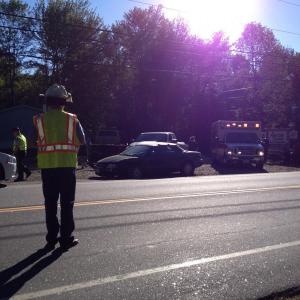 Edgecomb Fire Chief Roy Potter directs traffic on Route 27. RYAN LEIGHTON/Boothbay Register