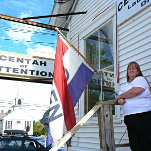 Juanita Kristoff waits for customers in front of Centah of Attention at Boothbay Center. “My customers are the best part of this work,” Kristoff said. “I’ll miss them the most.” KATRINA CLARK/Boothbay Register Juanita Kristoff waits for customers in front of Centah of Attention at Boothbay Center. “My customers are the best part of this work,” Kristoff said. “I’ll miss them the most.” KATRINA CLARK/Boothbay Register