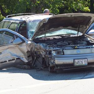 A Mercury station wagon sits along Route 27 in front of T&D Variety in Boothbay after an accident Wednesday, Sept. 4. GARY DOW/Boothbay Register