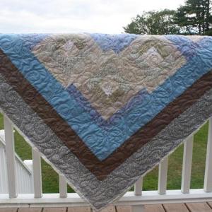 QUILT RAFFLE. The Boothbay Region Lions Club is holding a quilt raffe. Lion Susie Giles made the quilt and Lynn Irish did the quilting on the top. It's a “Log Cabin Handmade quilt” and those who want to buy a raffle ticket can call Giles (207-633-3640) or any Lions Club member. Courtesy of the Lions Club