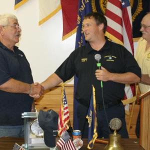 Allan Hitt, left, is honored by Robbie Ham, center, Boothbay Region Ambulance Service director, at the Hometown Heroes event held at the American Legion Hall on September 12. Hitt joined the BRAS in 1976 and retired in 2012. At right is Rotarian Daren Graves, who organizes the annual event with his wife, Debbie. KEVIN BURNHAM/Boothbay Register
