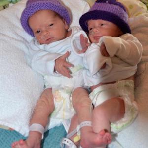 Harper and Willow, twin girls at Mid Coast Hospital Maternity Care Center in November 2011, proudly wear their new purple caps in recognition Families CAN! Courtesy of Steve Trockman, Mid Coast Hospital