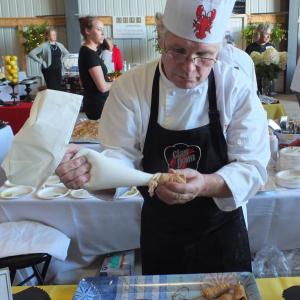 Claw Down Grand Prize Judges Choice Chef Mike Ham of Tugboat Inn & Restaurant prepares his winning “lobster bite.” SUZI THAYER/Boothbay Register