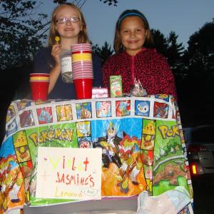 On a brisk Friday night in Alna September 6, two Wiscasset Primary students and best friends, Violet Wilson-Wood, left, and Jasmine Rego sell  iced tea on Route 218 to raise money to save St. Andrews Hospital. Rego's dad Mark Rego was born there. SUSAN JOHNS/Wiscasset Newspaper