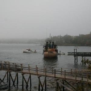 The towing of the Westward begins off Signal Point. Courtesy of Barbara Freeman