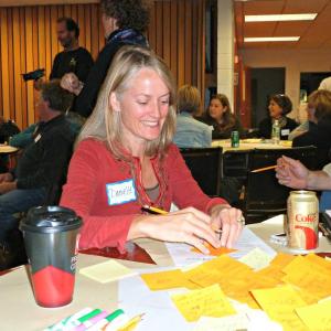 Danielle Betts of East Boothbay writes “the night sky” on a sticky note as a thing of value in our region. KATRINA CLARK/Boothbay Register