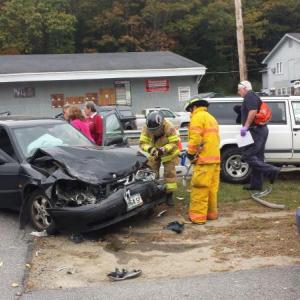 The driver of a black Saab stood near her smashed car shortly after noon Wednesday in Boothbay Harbor. The Saab and a white Jeep Cherokee collided near Hammond Lumber. Although the damage to both cars was substantial, there didn’t appear to be any major injuries. BEN BULKELEY/Boothbay Register The driver of a black Saab stood near her smashed car shortly after noon Wednesday in Boothbay Harbor. The Saab and a white Jeep Cherokee collided near Hammond Lumber. Although the damage to both cars was substantial, there didn’t appear to be any major injuries. BEN BULKELEY/Boothbay Register