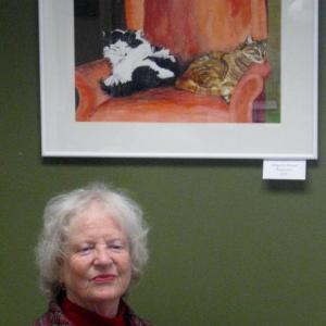 Artist Judy Nixon with framed felines, “Abigail and Emma" now on exhibit at First Federal Savings and Loan in Boothbay Harbor. Courtesy of Sandy Terry