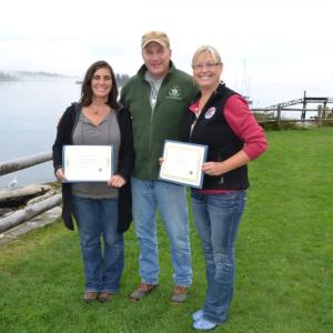 Maine Department of Marine Resources Commissioner Patrick Keliher (center) stands with DMR Manager of the Year, Alison Sirois, a DMR Scientist III (left), and Employee of the Year, Cathy Fetterman, DMR Licensing Manager (right), after each received an award during the department’s annual meeting in September. The Manager of the Year Award was presented to Sirois for overseeing water quality and safety along the entire coastline for the Bureau of Public Healthy. Fetterman received the employee of the year fo