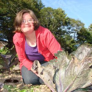 Anna McDougal of Wiscasset looks up from weeding rows of chard at Buckwheat Blossom Farm. She has a new book out, about her life with Down Syndrome. SUSAN JOHNS/Wiscasset Newspaper