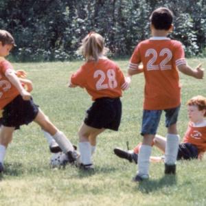 Yes, Nicole “The Lion” Lyons played organized sports. She started out as the muscle on an all-boys team, seen here, then went on to become a yearly three-season athlete before retiring at age 18. She never played football, but she played soccer and lacrosse, which she says adds up to football somehow. (She was never good at math.) Courtesy of Papa Lyons Yes, Nicole “The Lion” Lyons played organized sports. She started out as the muscle on an all-boys team, seen here, then went on to become a yearly three-season athlete before retiring at age 18. She never played football, but she played soccer and lacrosse, which she says adds up to football somehow. (She was never good at math.) Courtesy of Papa Lyons