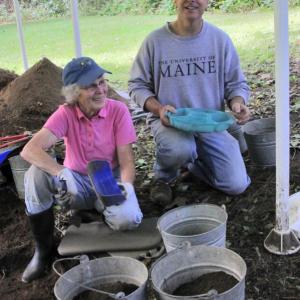 Archaeologist Tim Dinsmore and volunteer Betsy Evans of Newcastle discuss progress at an archeology site that dates back to the birth of shipbuilding on the Damariscotta River. Courtesy of Alan Crowell