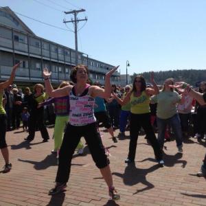Sarah Brewer, center, leading a Zumba flash mob at the 2013 Fishermen's Festival. From left, students are Laurie Dickinson, Julie Higgins, Nicci Manson Doray, Kathleen Lamothe, Debbie Bailey Speed, Eileen Higgins, and Whitney Spaulding Wright. Courtesy of Robert Brewer