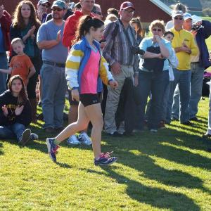 Senior Sophia Thayer walks up to the winner circle after finishing fourth place overall in the state championship race. RYAN LEIGHTON/Boothbay Register