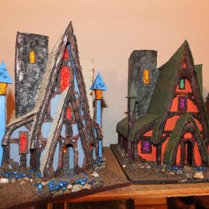 The many model houses Lee designs and builds as a hobby. The “Witches House” on the right is what Lee plans to build next. RYAN LEIGHTON/ Boothbay Register