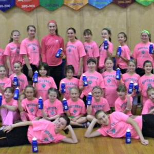 The BRES Lady Dribblers posing with their new water bottles. The dribblers were all wearing pink on Nov. 26 as part of a fundraiser for curing breast cancer. Courtesy of Judy Dorr/BRES