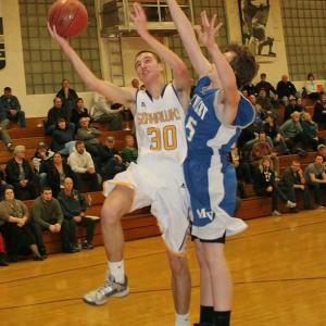 Evan Hepburn goes hard to the basket to score two of his game-high 20 points against Mountain Valley on Monday night, January 13 as the Seahawks won easily, 79-36. KEVIN BURNHAM/Boothbay Register Evan Hepburn
