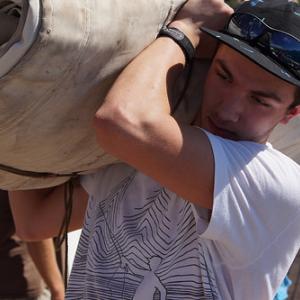 Josiah Purin at work loading the Harvey Gamage. Courtesy of Sarah Gudroe Photo of Josiah Purin