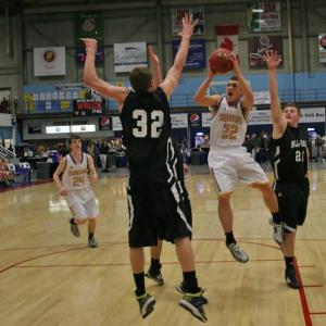 Senior captain Andrew Hallinan puts up a running shot against Hall-Dale during the first half of Monday’s Class C quarterfinal tournament game at the Augusta Civic Center. KEVIN BURNHAM/Boothbay Register Hallinan