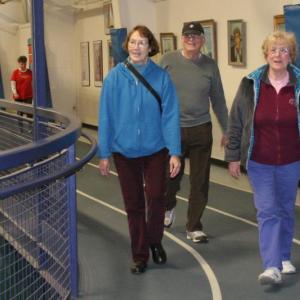 Sharon Barter, left, walks with Ira and Connie Machon on the YMCA track on Tuesday, March 25. KEVIN BURNHAM/Boothbay Register