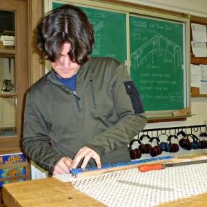 Senior Ben Betts setting the frets into his guitar neck. “It’s a long process because you have to make sure you do it right,” Betts said. KATRINA CLARK/Boothbay Register