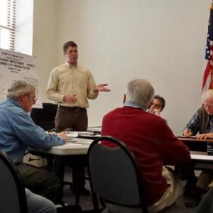 TRAVIS PRYOR, center, talks March 10 during a Damariscotta Waterfront Committee meeting. The meeting touched on a variety of topics, including the possibility of adding a parking garage near the water. BEN BULKELEY/Wiscasset Newspaper