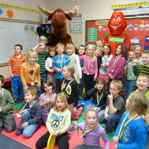 Boothbay Region Elementary School first graders are excited to see Mainely Moose and Redy during the duo's visit and awarding of medals on Friday, March 21. Courtesy of Healthy Lincoln County