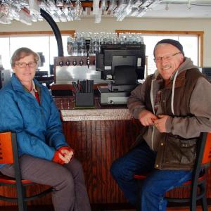 DEB AND JON HODGDON sit at the bar of their new restaurant, Herringbone’s Pub & Grill. SUZI THAYER/Boothbay Register